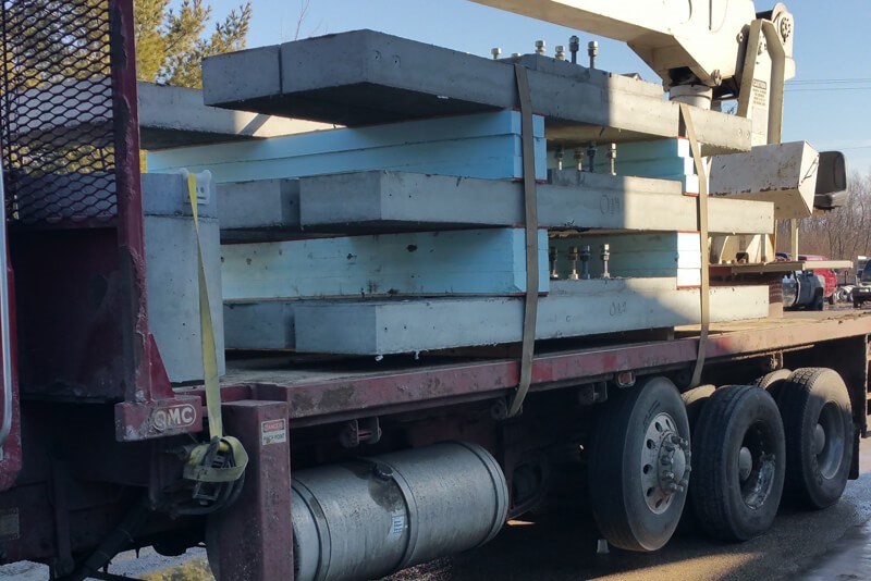 Concrete slabs loaded and secured to a truck