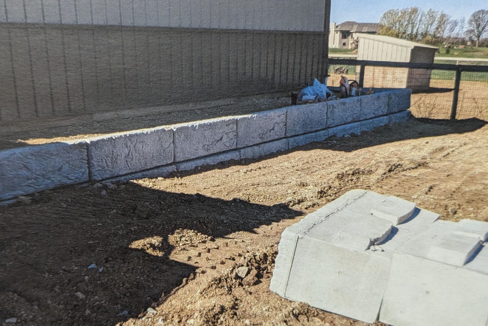 Concrete retaining wall foundation